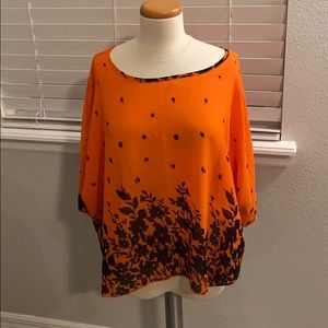 Orange and Black dress top.